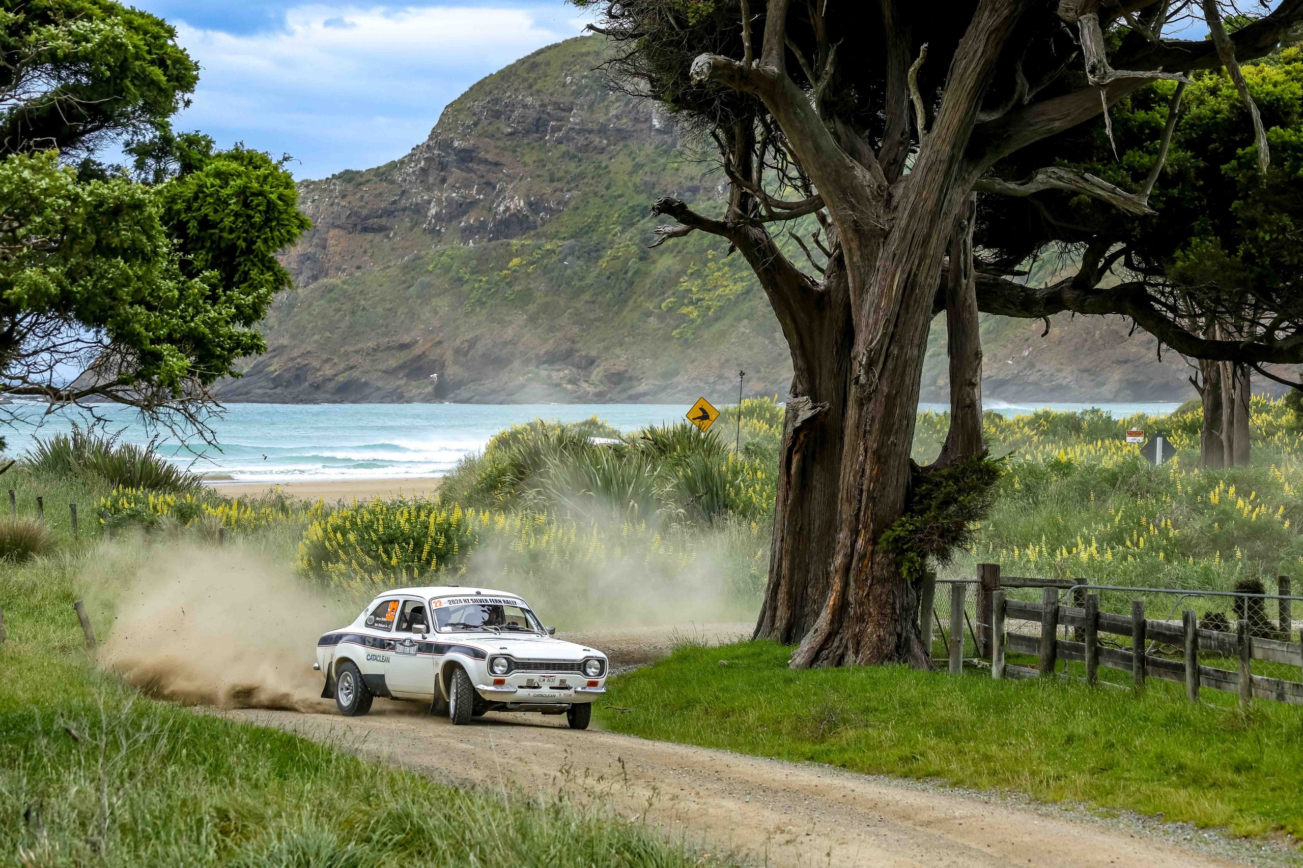 Modern 2WD rally car on gravel stage